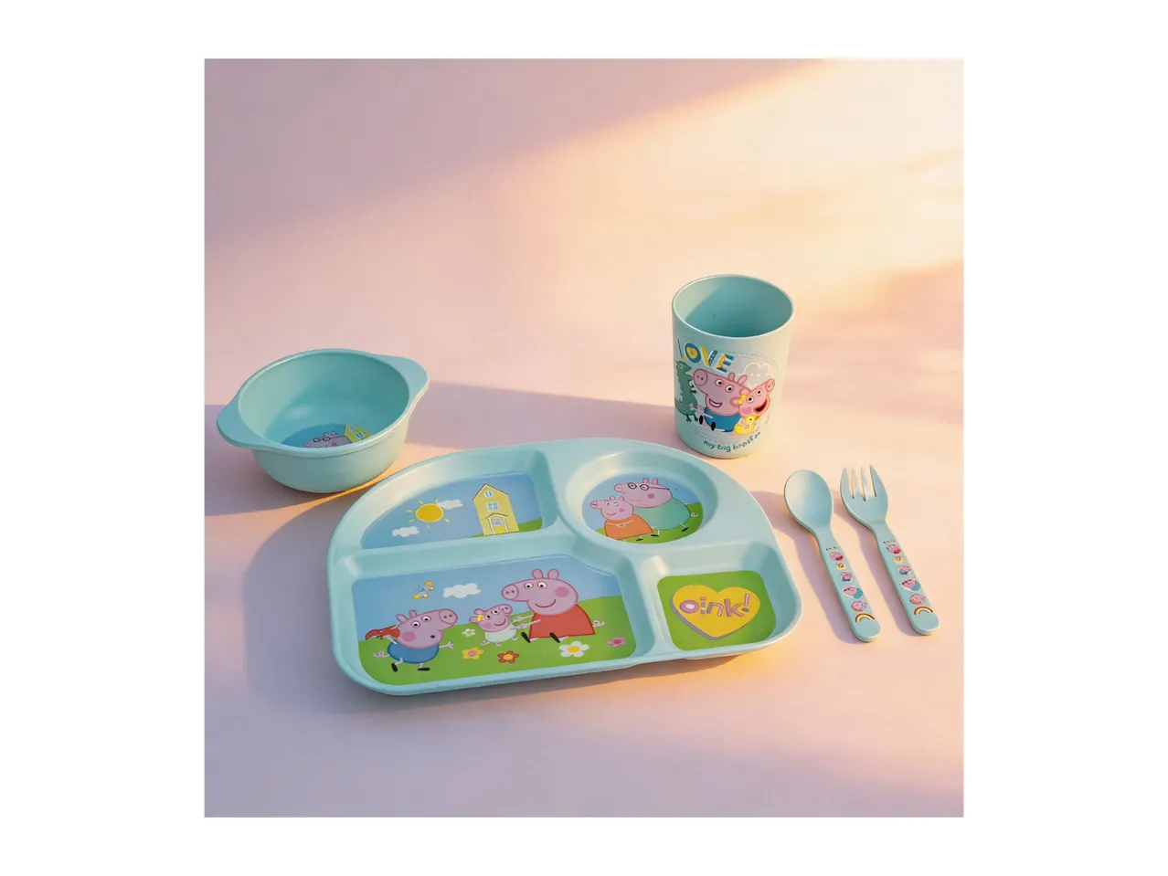 Children's dining set with Peppa Pig characters, including a divided plate, bowl, cup, fork, and spoon.