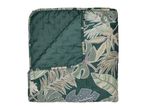 Quilted blanket with a tropical leaf pattern in shades of green, beige, and white.