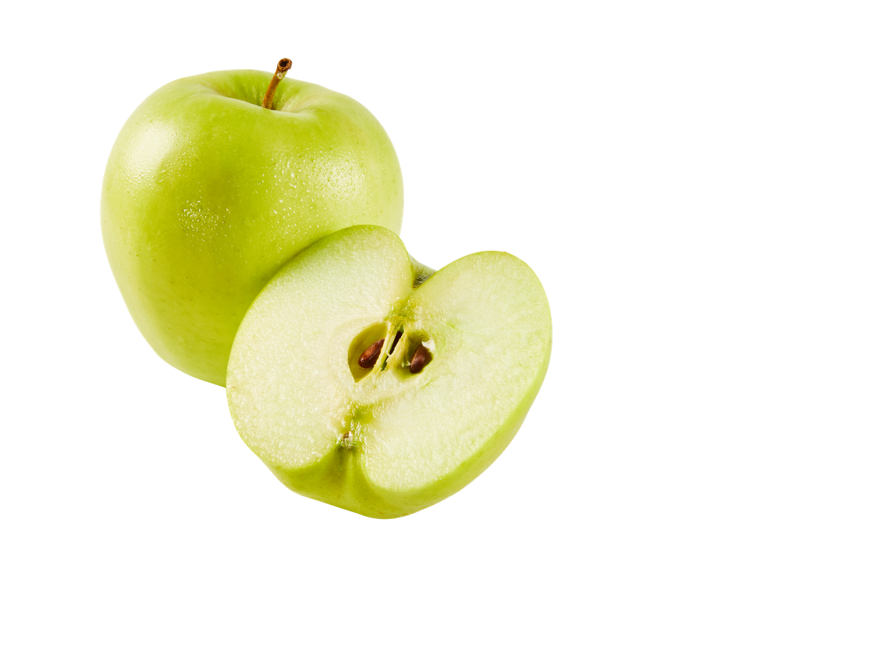 Rohelised õunad, üks terve ja üks poolitatud seemnetega.