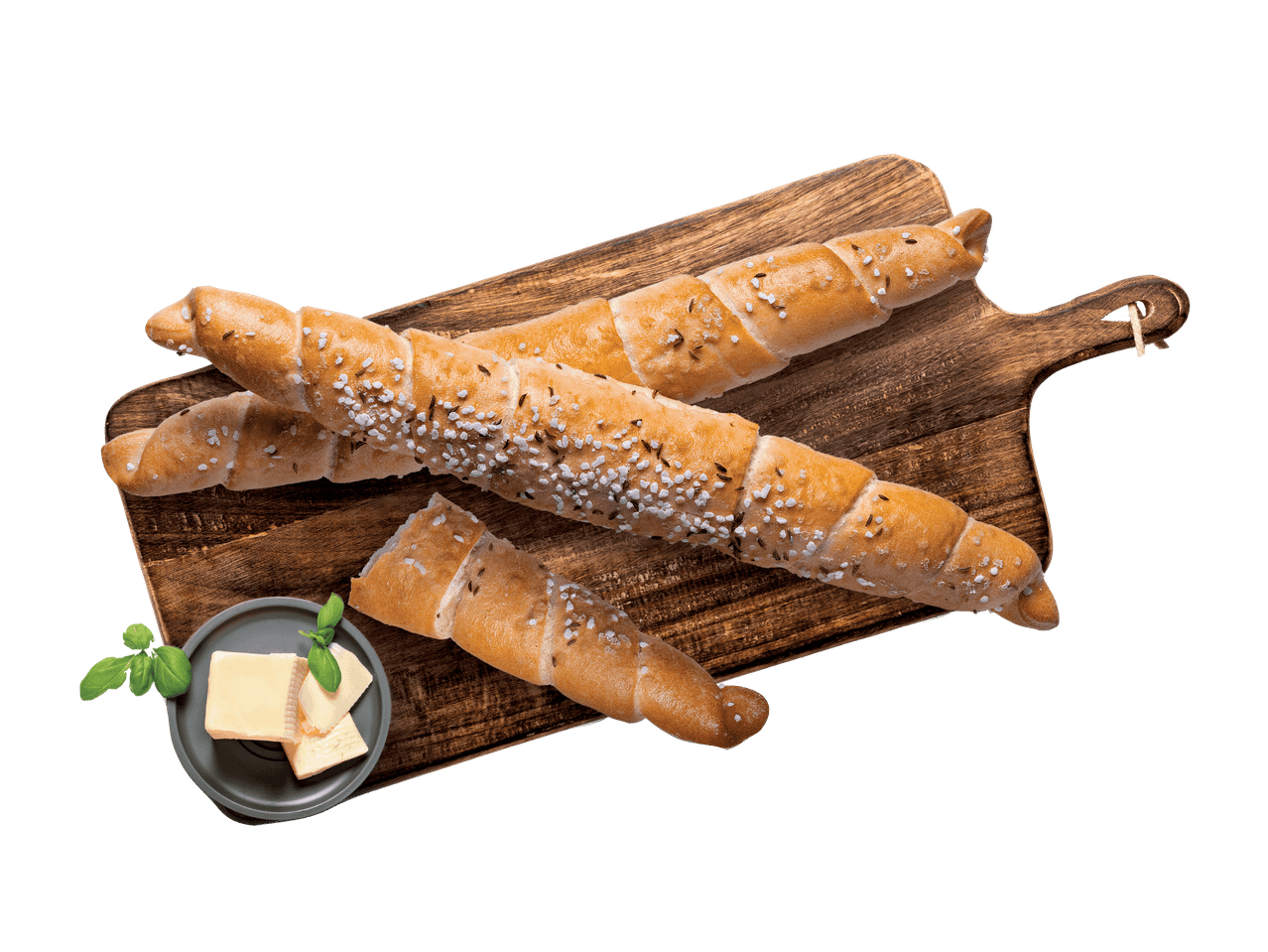 Salzstangen mit Kümmel auf einem Holzbrett mit Butter und Basilikum