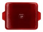 Red rectangular baking dish with handles, showing care symbols on the bottom.