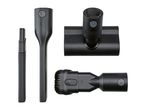 Four black vacuum cleaner attachments, including a crevice nozzle and upholstery nozzle.