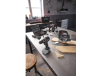 PARKSIDE PERFORMANCE® 20V Cordless Hammer Drill, jigsaw, and drill on a workshop table.