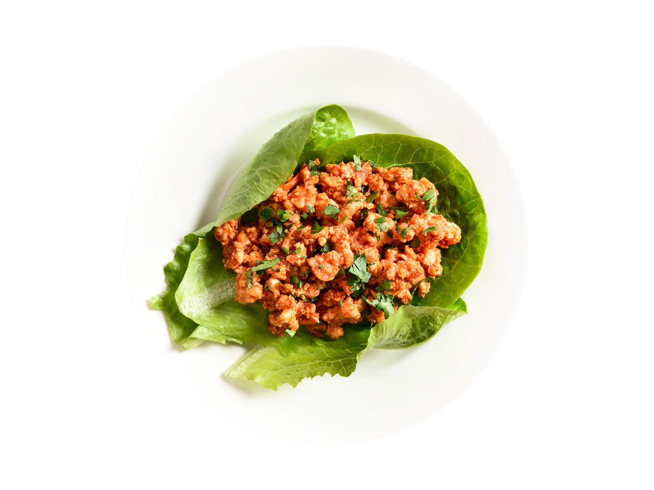 Lettuce wraps with spicy minced chicken or pork, garnished with fresh herbs.