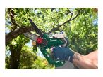 A person wearing gloves uses a cordless mini chainsaw to cut a tree branch.