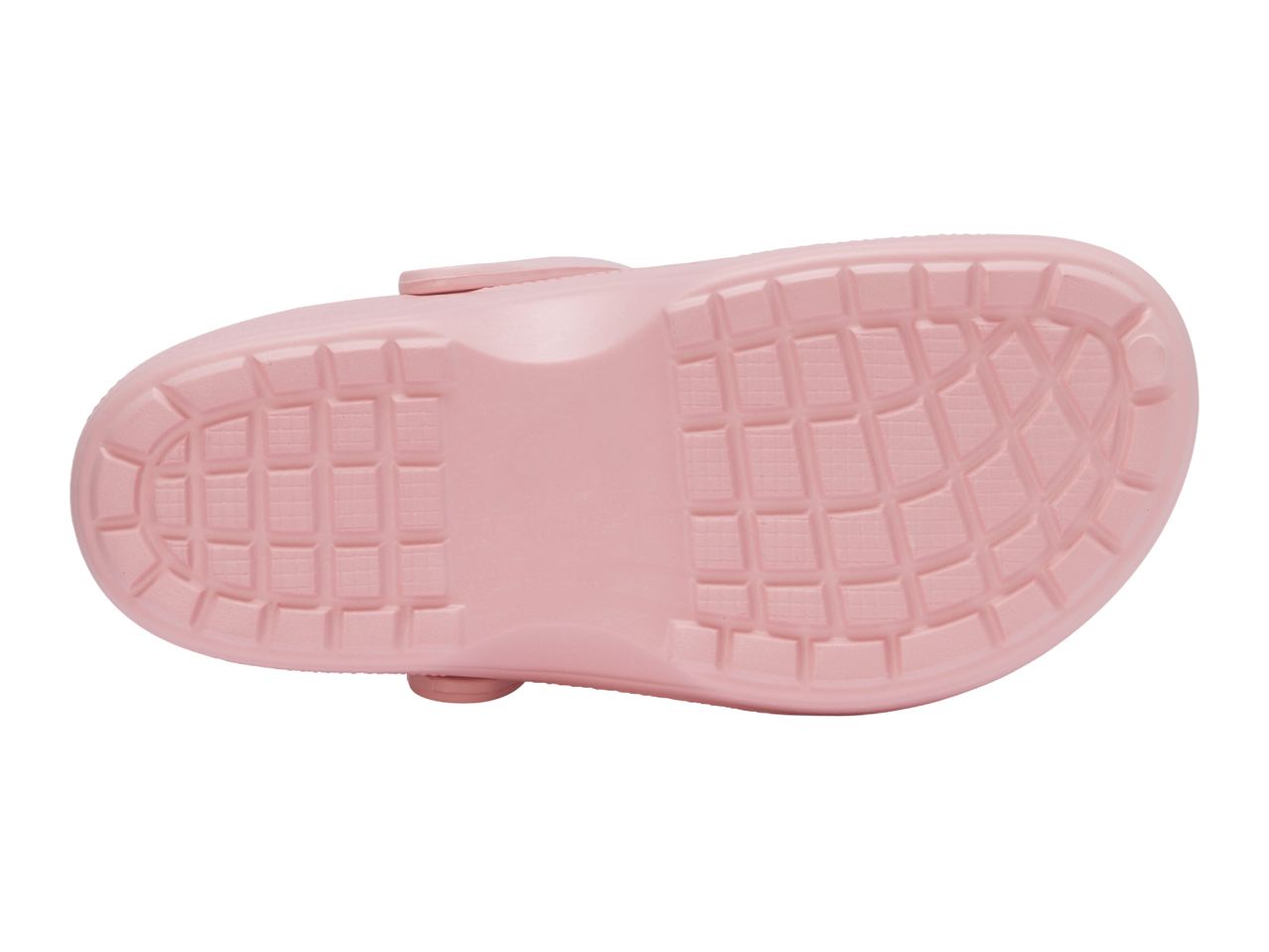 Bottom view of a pink children's clog with a textured sole