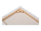 Back of a stretched canvas with wooden frame and staples, showing the texture of the canvas.