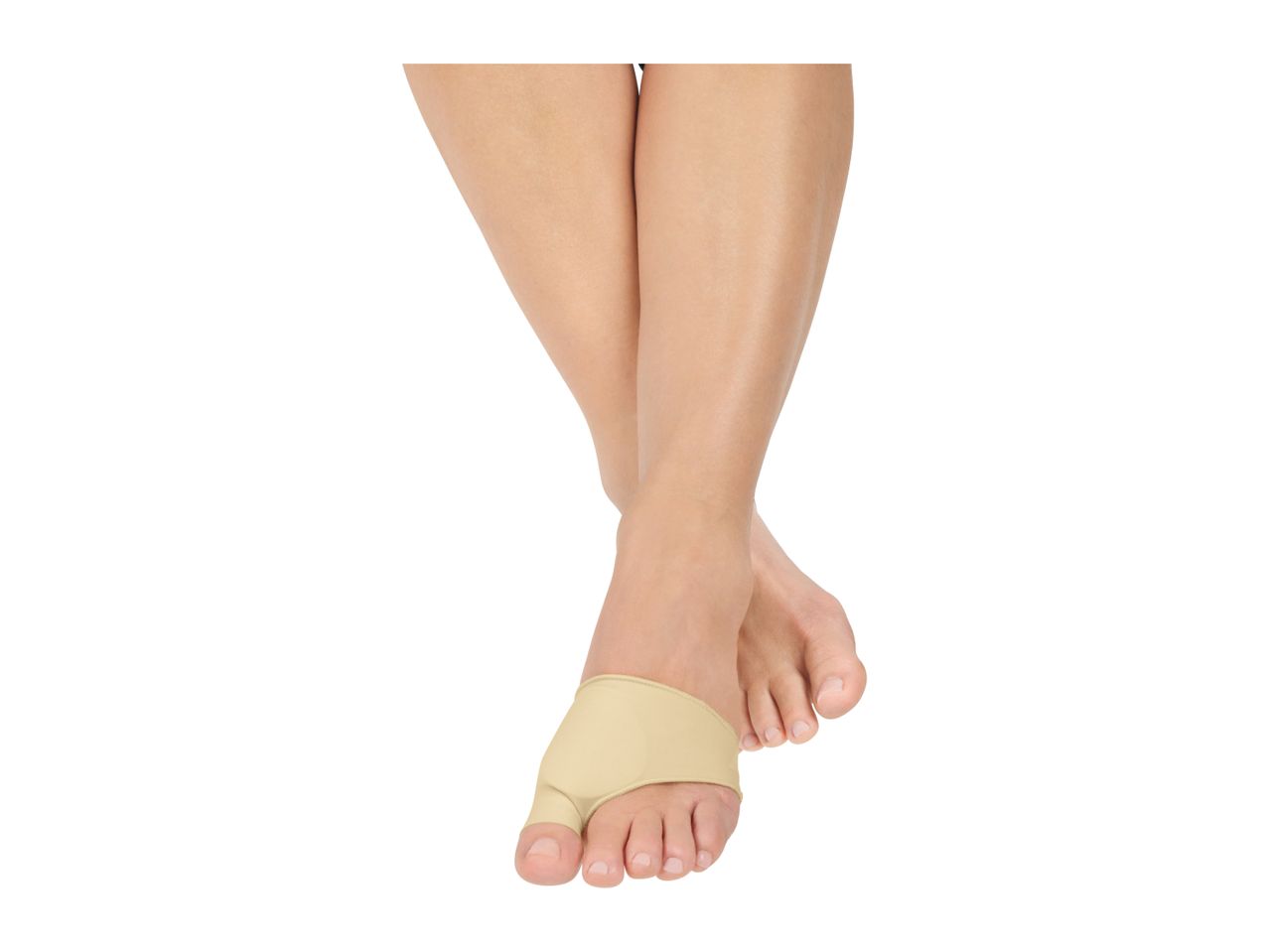 A person's legs and feet, with one foot wearing a beige bunion corrector.