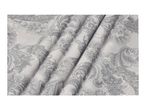 Light grey fabric with a dark grey and white paisley pattern, draped in folds.