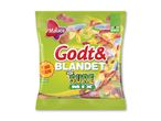 Grøn pose med blandet surt slik i forskellige farver og former, mærket 'Fun Size' og 'Glutenfri'.