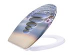 Toilet seat with a printed image of stacked zen stones and lavender flowers.