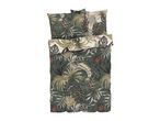 Tropical bedding: duvet cover and pillows with leaf print.