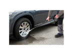 Car wheel cleaning with Parkside pressure washer.