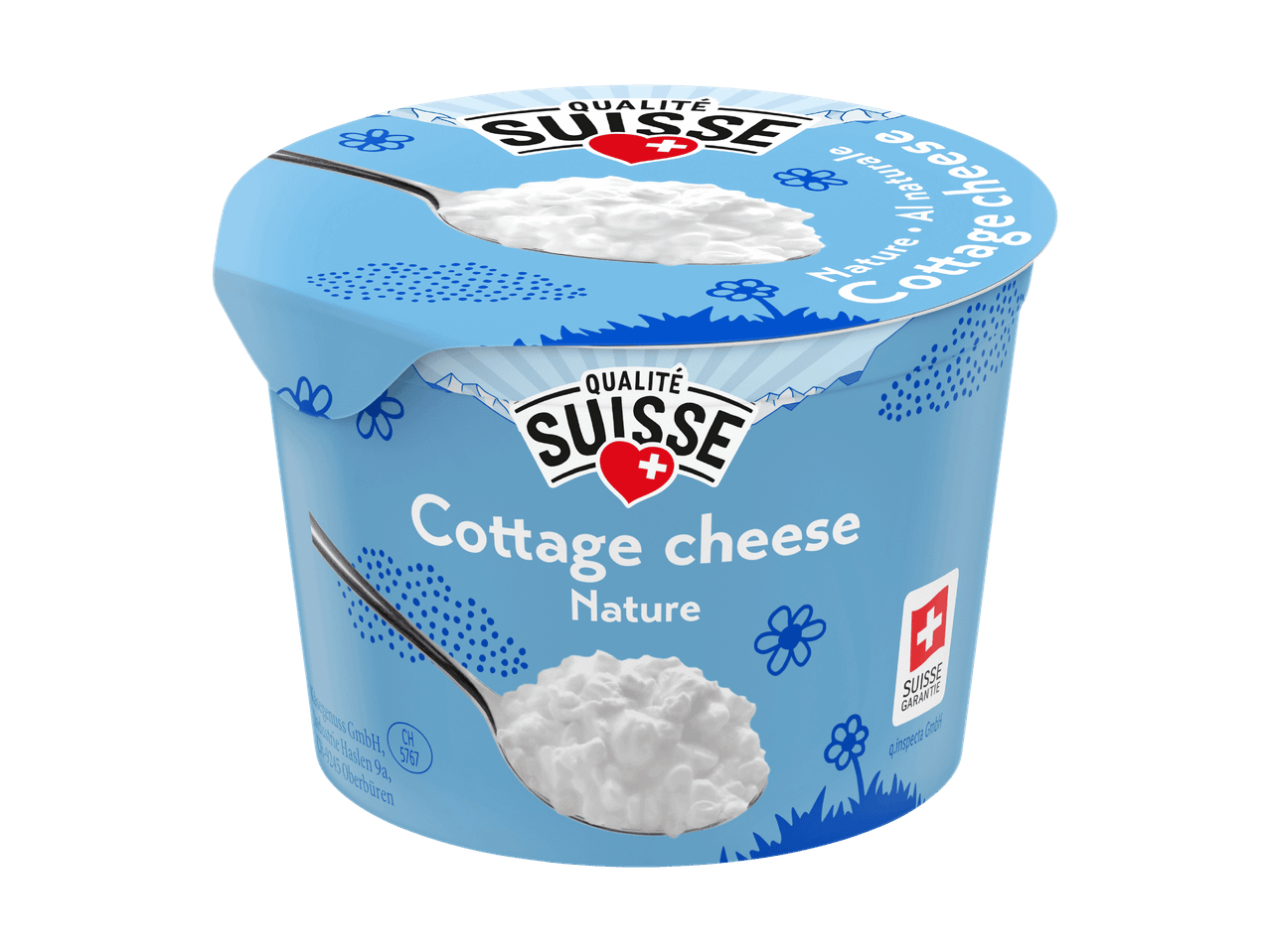 Vasetto di fiocchi di latte naturale con un cucchiaio, sfondo azzurro con motivi floreali.