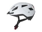 White bicycle helmet with black visor and straps, featuring ventilation holes and a rear light.