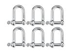 Six shiny metal D-shackles arranged in two rows.