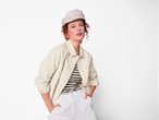 Esmara Ladies' Corduroy Overshirt in beige, worn over a striped top with white trousers.