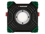 Lampă de lucru LED Parkside® în negru și verde cu accent roșu.