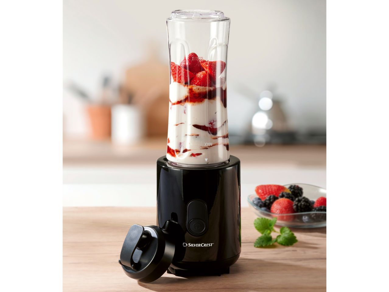 SilverCrest personal blender with fruit and yogurt, and a bowl of berries.