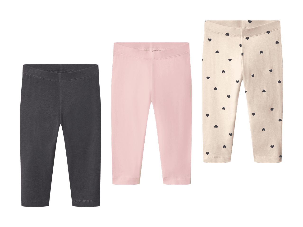 Tre par leggings: et gråt, et lyserødt og et cremefarvet med sorte hjerter.