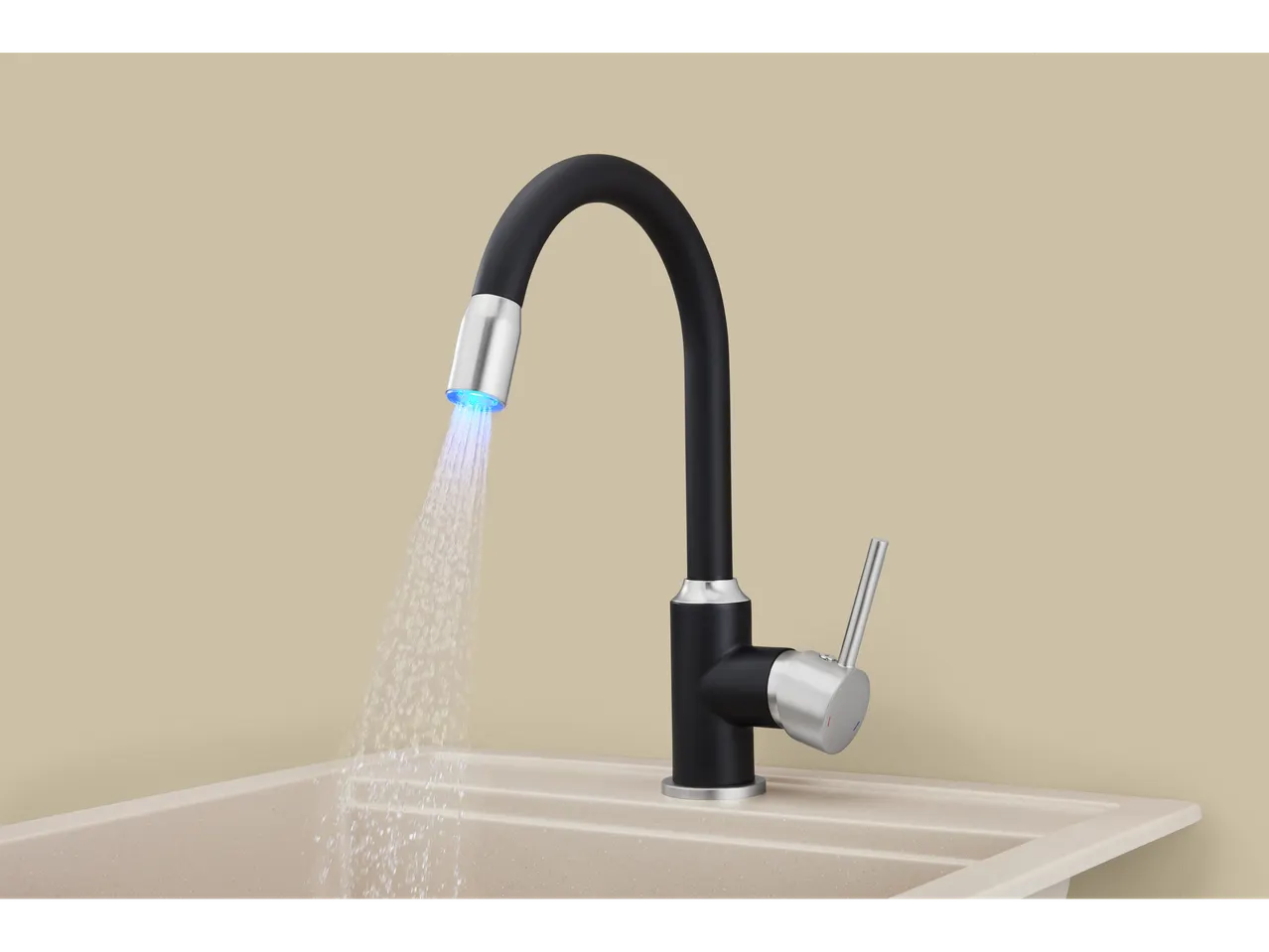 Rubinetto da cucina nero con doccetta estraibile e luce blu, sopra un lavello beige.