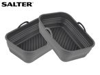 Two grey silicone air fryer liners with handles and ribbed bases.
