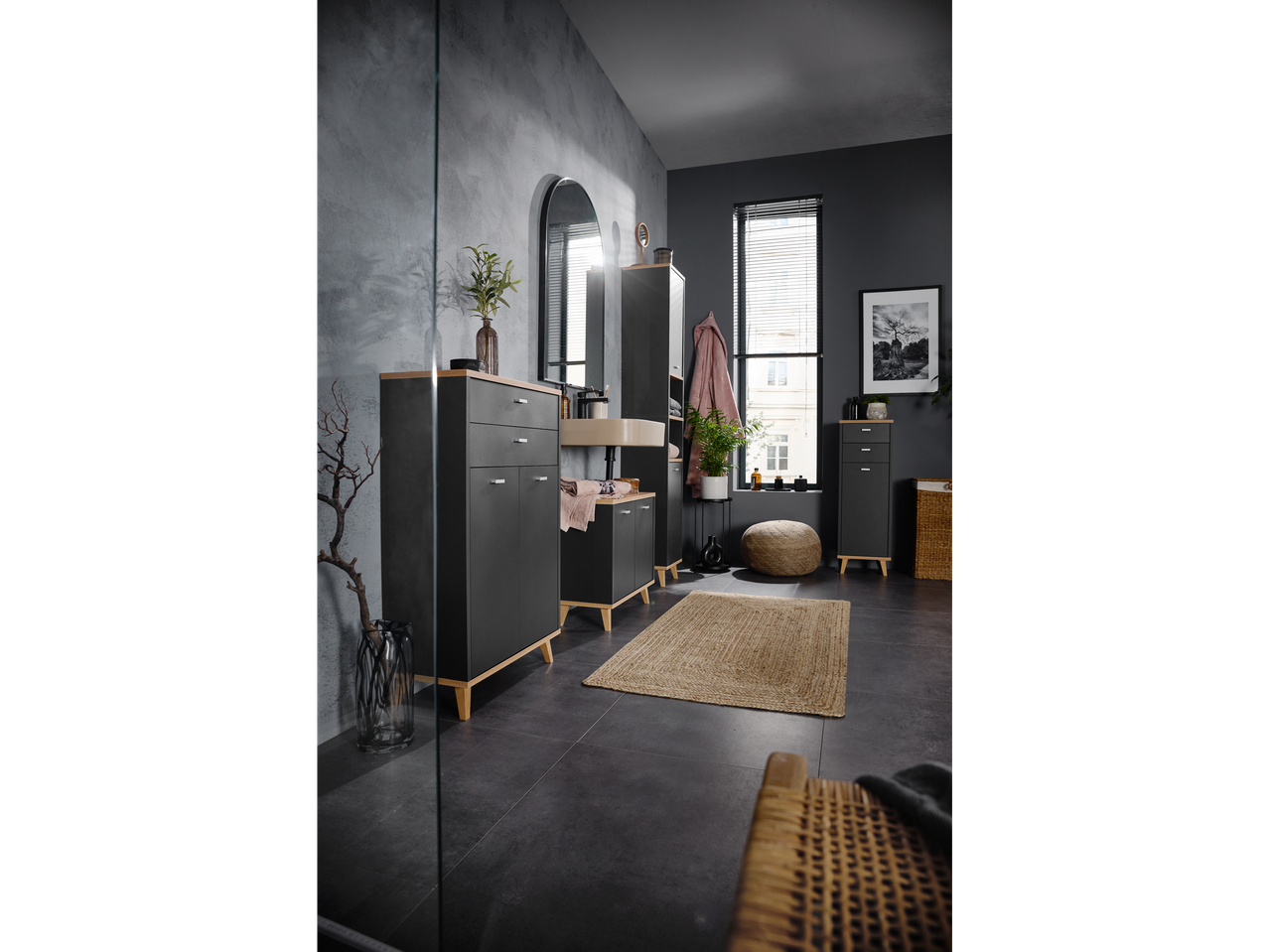 LIVARNO home Corfu bathroom cabinets in a dark, modern bathroom with a jute rug.
