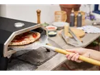 Outdoor pizza oven and pizza peel.