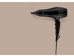 Uscător de păr negru Cien Beauty pe fundal bej.