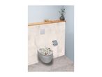 Toilet with a floral patterned seat, toilet paper holder, and a wooden shelf with decor.