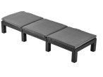 Livarno Wicker Sun Lounger with three grey cushions on a black background
