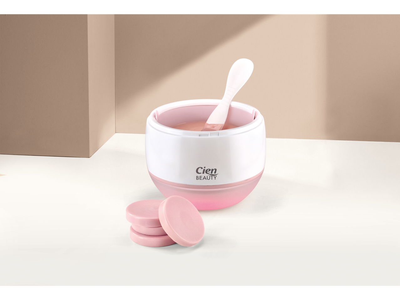 Cien Beauty: Aquecedor de cera rosa com espátula e discos de cera.