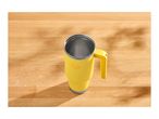 Yellow travel mug with a handle on a wooden table with shadows.
