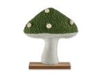 Grüner Pilz aus Stoff mit weißen Punkten auf einem Holzsockel.