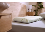 Livarno Premium Ergonomic Neck Support Pillow with bamboo design on a bed