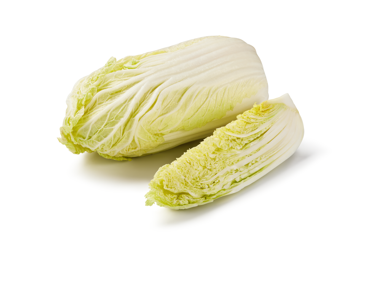 A whole head of Napa cabbage and a cut wedge are displayed against a white background.