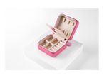 A pink, compact jewelry box with various compartments for earrings and other small accessories.