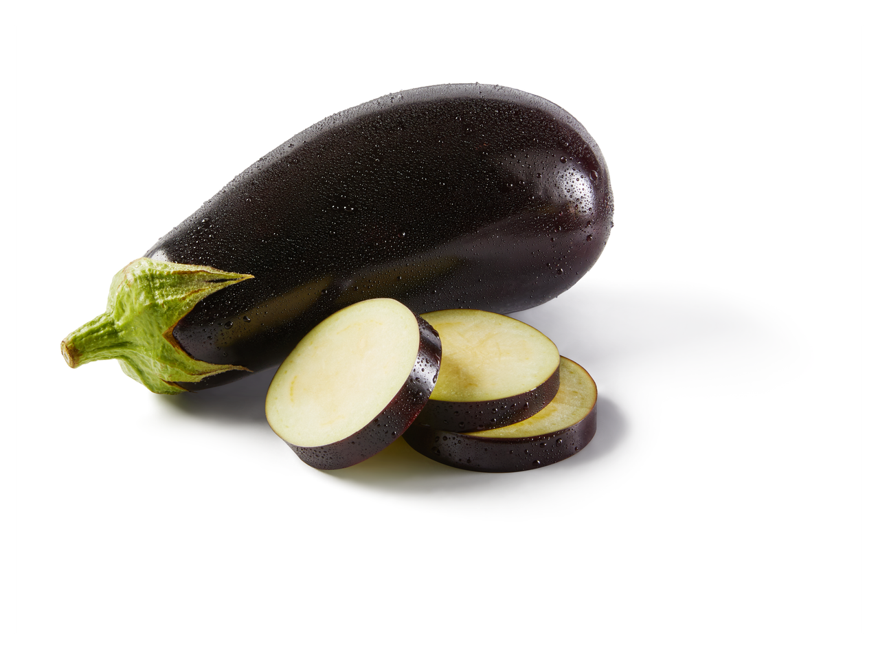 Fresh eggplant with water droplets, whole and sliced, on a white background.