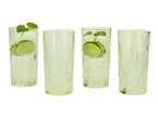 Four green patterned glasses, two with lime and mint in a clear drink.