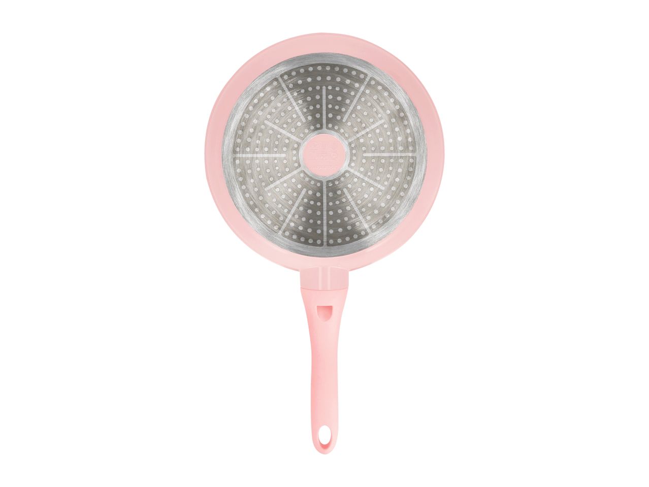 Pink frying pan with a textured silver base, viewed from the bottom.