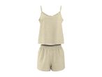 Light beige women's pajama set with a ruffled camisole top and elastic-waist shorts.