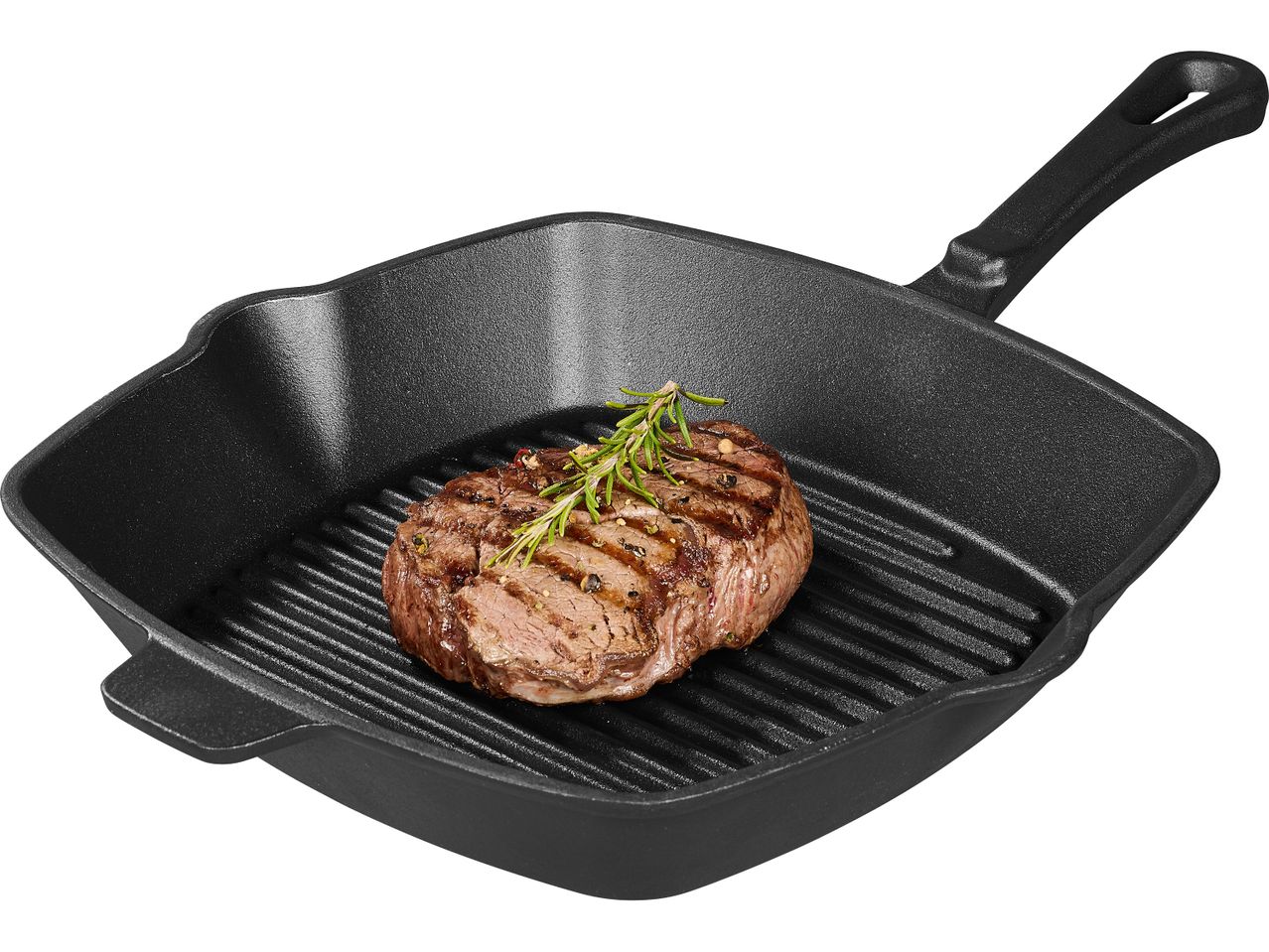 Grilled steak with rosemary and peppercorns in a cast iron grill pan