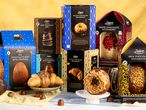 A collection of chocolate Easter eggs and novelty chocolate treats, including doughnuts and croissants.