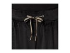 Close-up of black velvet sweatpants with a gold and black striped drawstring bow.