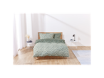 A bed with a teal floral duvet cover and matching pillowcases sits in a bright bedroom.