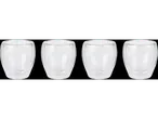 Four empty double-walled glass cups.