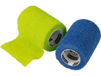 Two Sensiplast self-adhesive bandages, one green and one blue, partially unrolled.