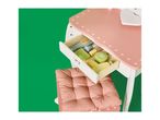 Pink and white toy dressing table with a drawer full of wooden beauty accessories.