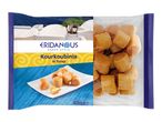 Greek-style Kourkoubinia in syrup, with a white plate of pastries and a clear package of more.