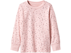 Pink long-sleeved top with scattered dark and light pink polka dots.